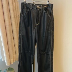 Black faux leather straight leg trousers.